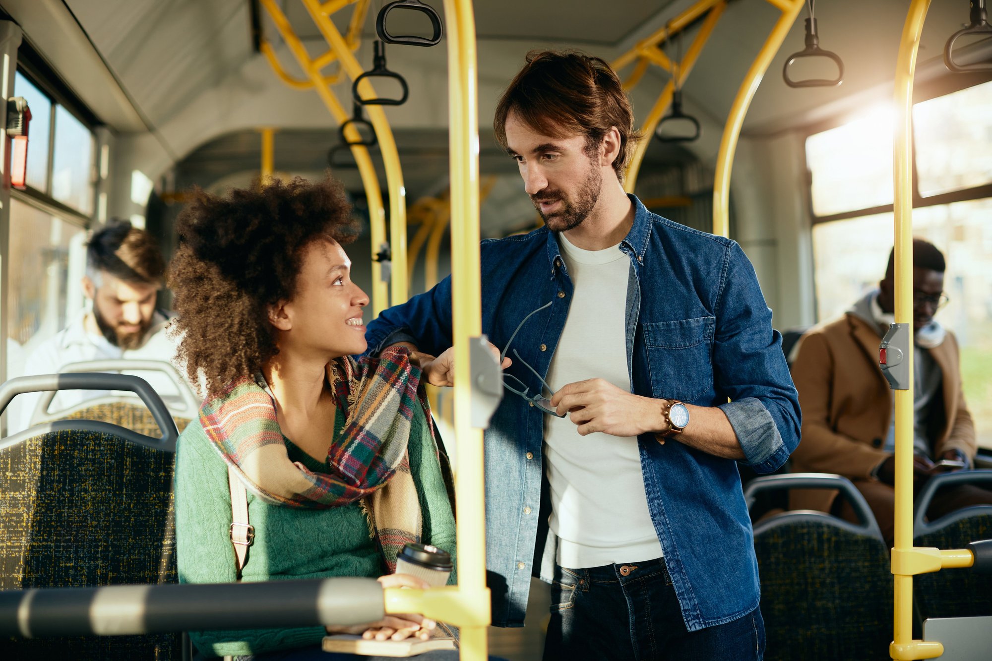 happy-couple-talking-each-other-while-commuting-by-bus-1